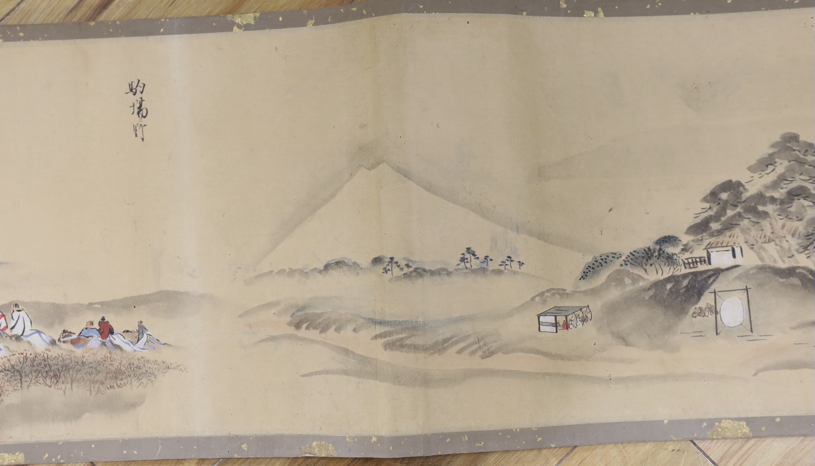 A Japanese landscape painting on paper hand scroll, Edo period, titled views, now in two parts, incomplete, image 27cm high x approximately 470cm wide